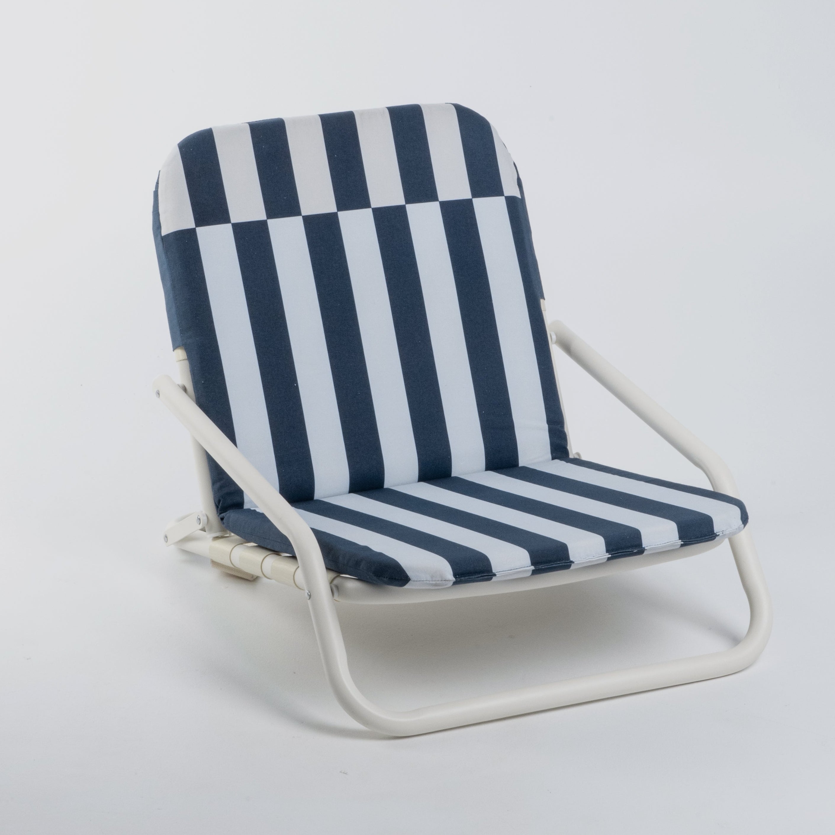 Blue and white striped beach chair on a light gray background