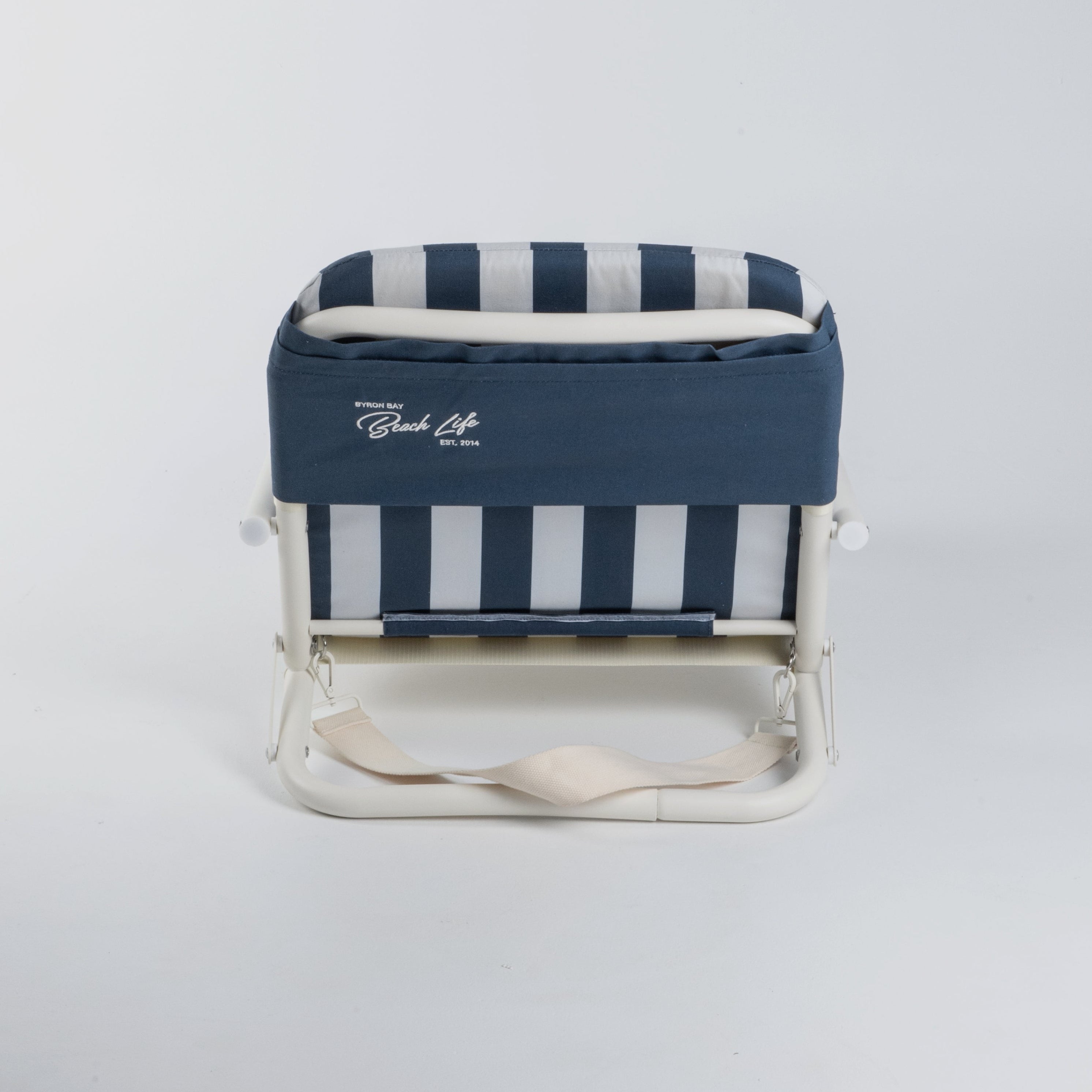 Blue and white striped beach chair with a logo on a light gray background