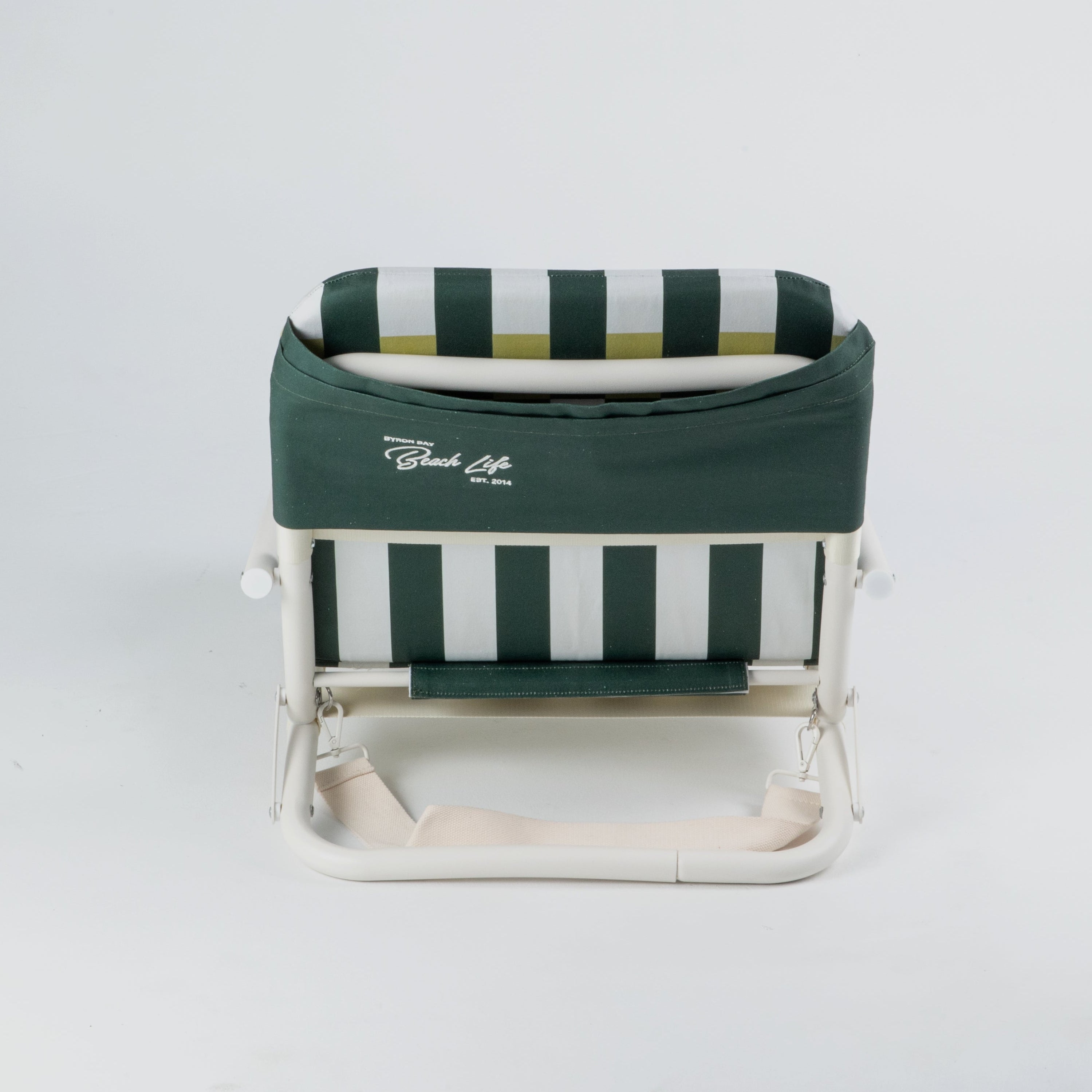 Green and white striped folding chair on a white background