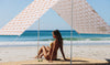 Beach Tent The Retro Beach Shade girl sitting under at Byron Bay 