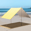 Beach Tent in Yellow and White Nautical Stripe. Beach Shade set up on beach in sun with blue sky 